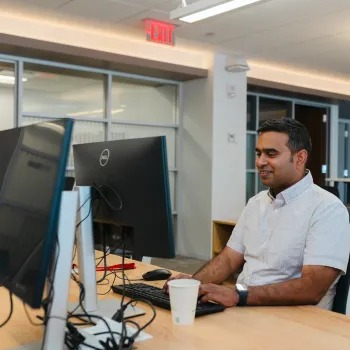 OSATT member sitting at computer
